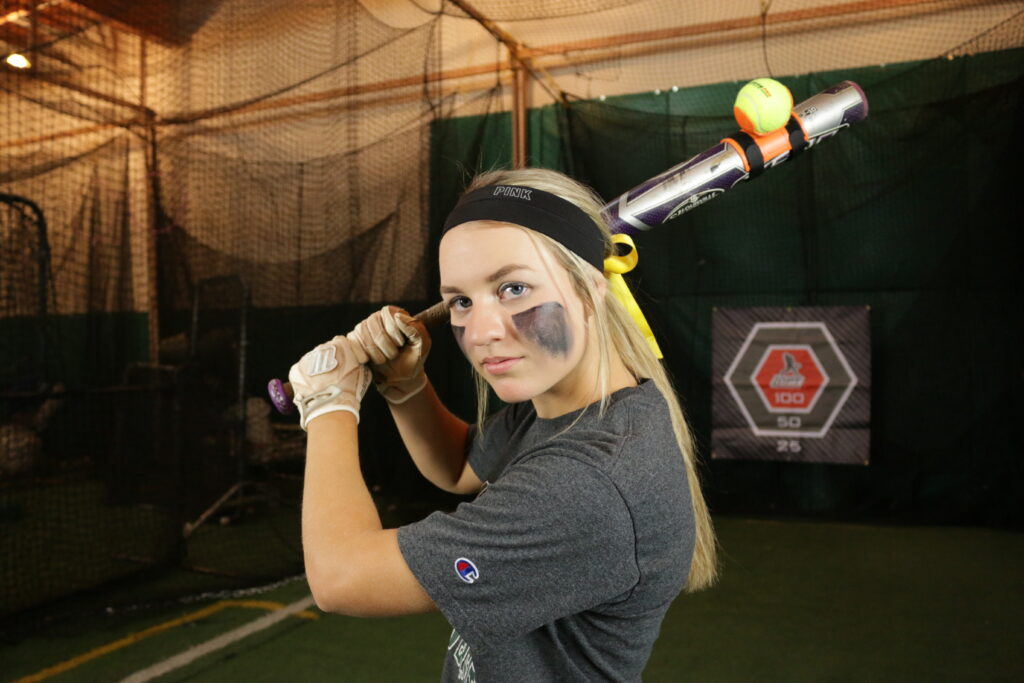 Woman using the LineDrivePro Swing Trainer