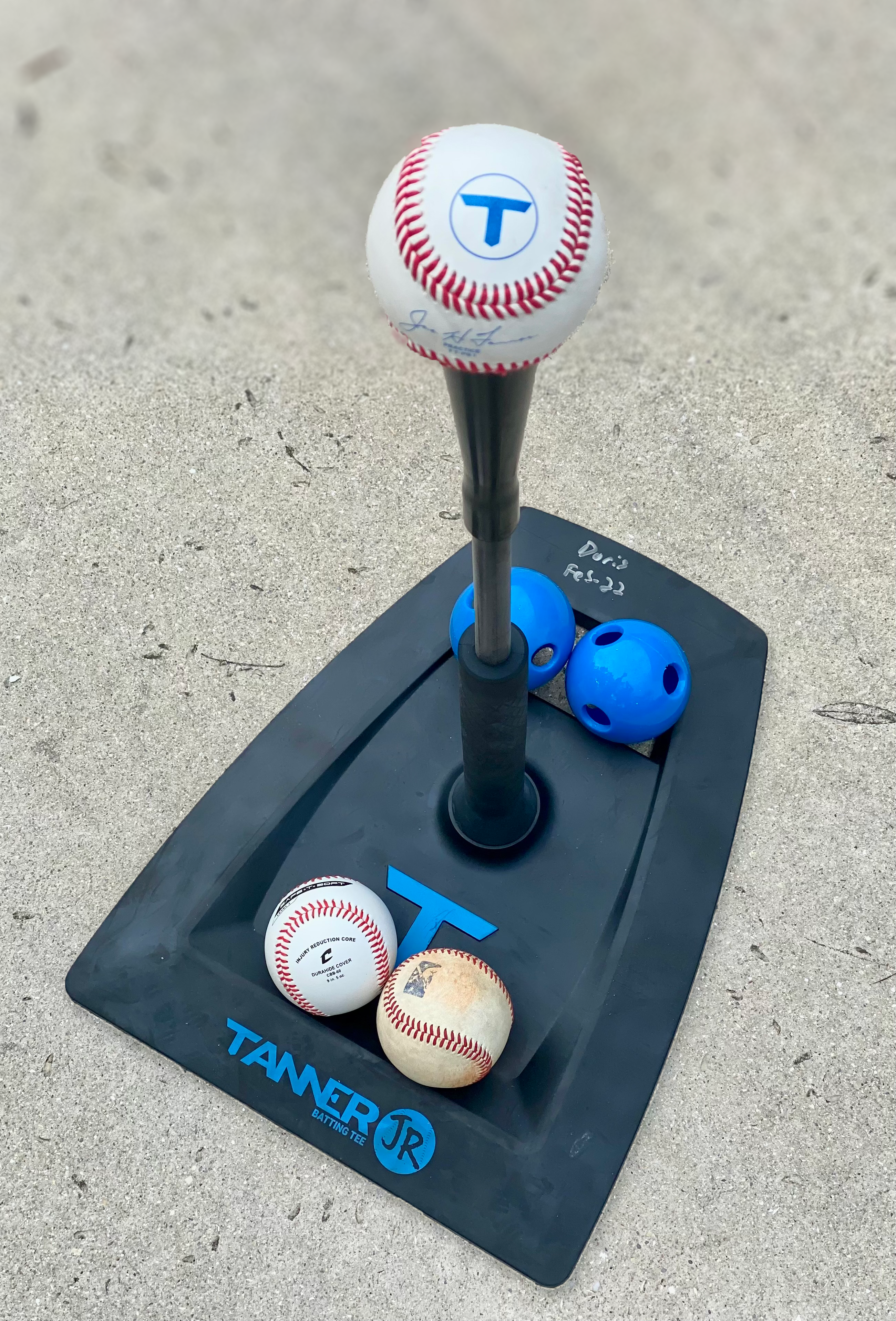 tanner jr batting tee with baseballs and softball